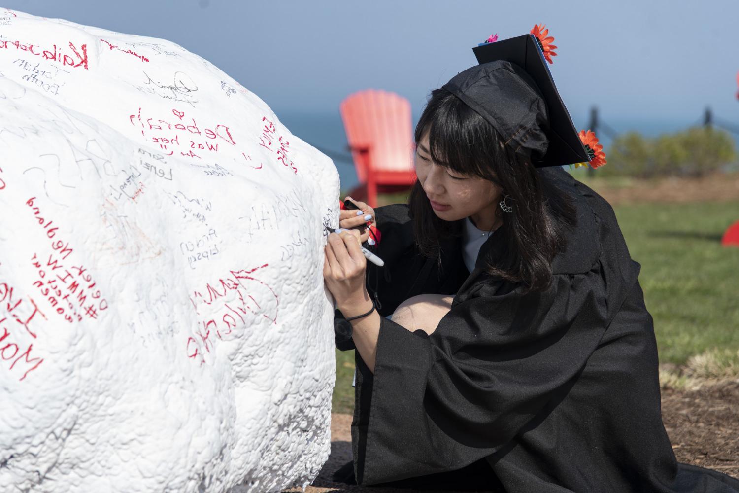 Today, students sign their names on Kissing Rock when they first arrive on campus, and four years...