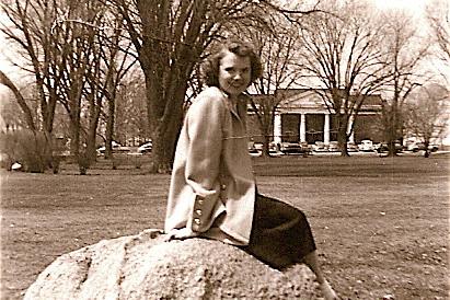 Kathleen (Peterson) Bradley is shown sitting on Kissing Rock at the Illinois campus, where she an...