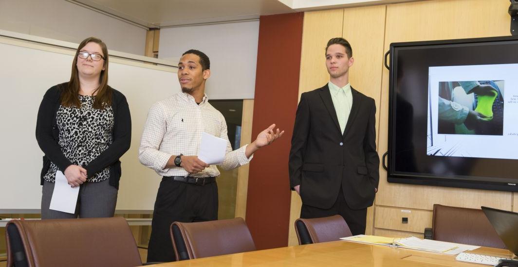 Students pursing a marketing major at Carthage College presenting a project in the Troha Boardroom.